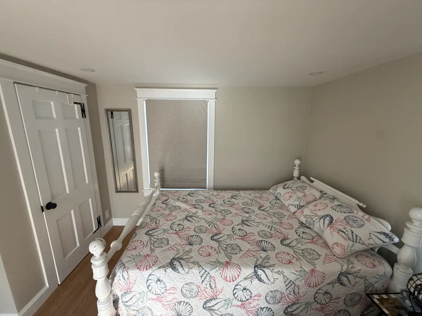 Living room storage bed dressed in shell linens